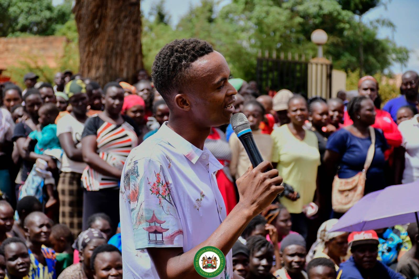 Gideon Lusweti with community members